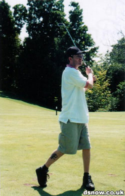 Snow playing golf